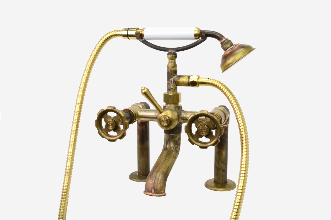 Photo: SP9494 in Raw Brass (RB) finish with White Handshower Handle