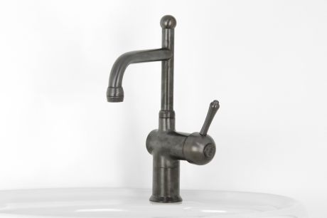 Roulette Lever Flick Mixer with Basin Victor Outlet in Weathered Brass immediately after manufacture