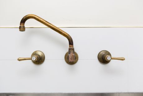 Roulette Lever Wall Sink Set with Upswept Outlet in Raw Brass Finish