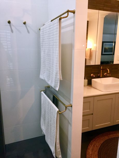 Roulette Double Towel Rails & Robe Hooks in Polish to Plate finish. Shown after install with initial maturing.