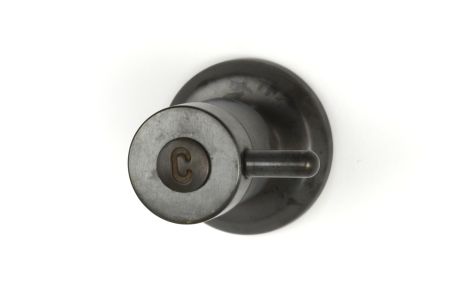 Torrens Lever Wall Top Assembly in Weathered Brass with Engraved Button, immediately after manufacture